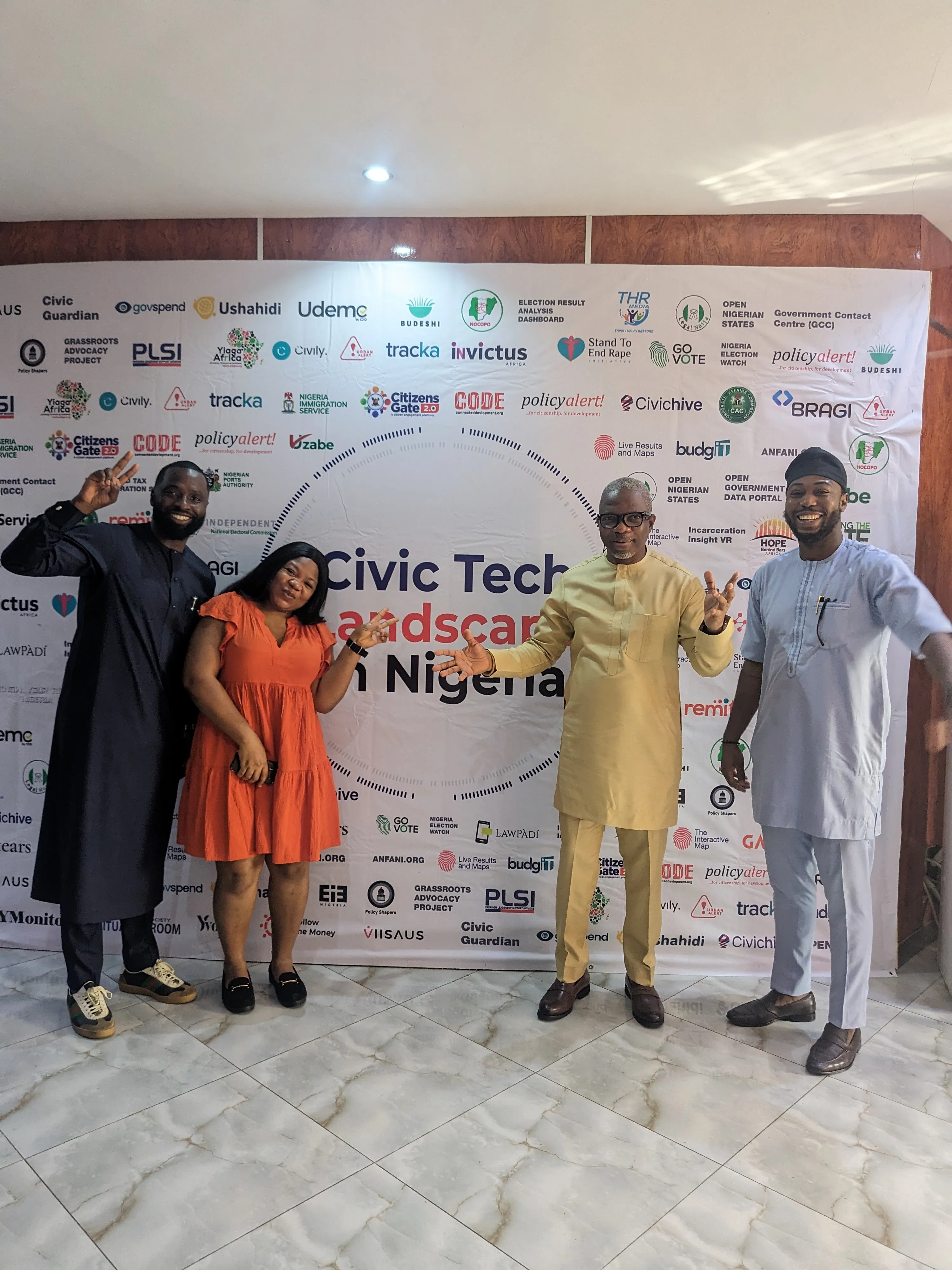Members of the Bragi team at the launch of the Civic Tech Landscape in Nigeria report, in front of the report backdrop listing the participating civic-technology organizations.