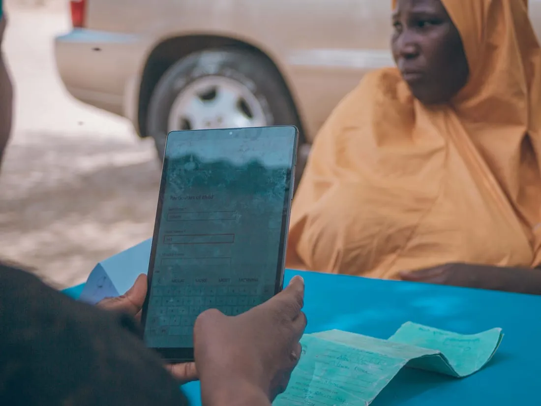 Reviewing information on a tablet during field work.